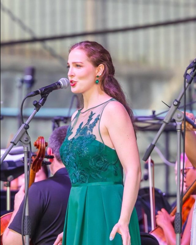 Michaela Larsen singing with orchestra at Charlottesville Opera